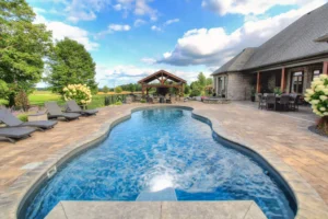 Luxury backyard with pool and patio seating.